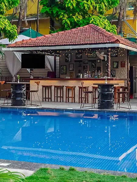 Pool and beach bar at a North Goa stay